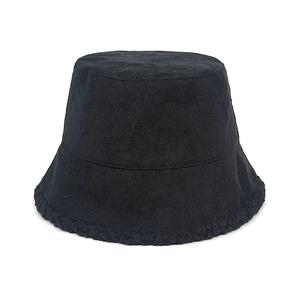 Detail of black corduroy bucket hat featuring thick lamb wool lining and plush brim