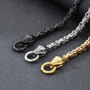 Three men's stainless steel Byzantine chains in black, silver, and gold with snake heads