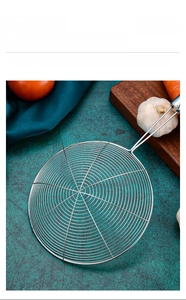 Detail of the spider strainer featuring a dense spiral stainless steel wire mesh design