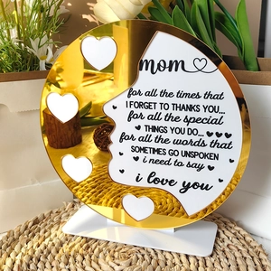 Detailed view of acrylic Mother's Day plaque with golden mirror hearts and white base