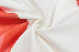 Macro shot of red and white diagonal twill fabric texture for summer two-piece set