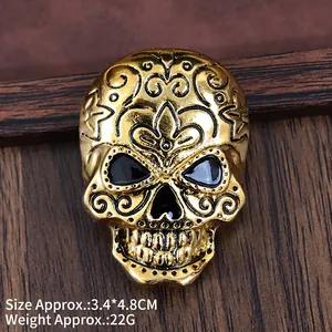 Golden skull brooch with black floral engraving for Halloween suits, 3.4 by 4.8 cm