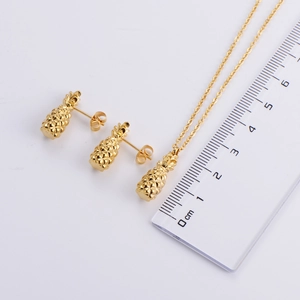 Gold titanium steel pineapple necklace and earrings jewelry set shown with size scale