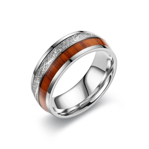 Vintage stainless steel ring with wood and meteorite texture inlay on white background