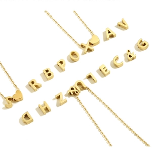 Detail showing various gold stainless steel letter charms for DIY personalized necklaces