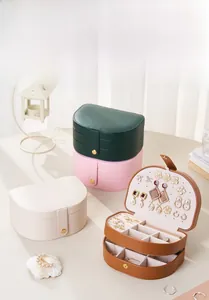 Three-tier portable PU leather jewelry box with textured surface and metallic round lock
