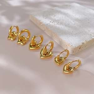 Set of three pairs of gold-plated stainless steel star and heart stud earrings for women