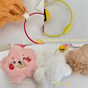 Close-up of star plush charm showing embroidery details and screw-lock wire ring