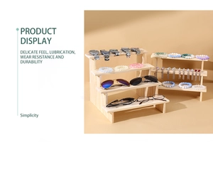 Multi-tier wooden display stand showing jewelry, glasses and watches in detail