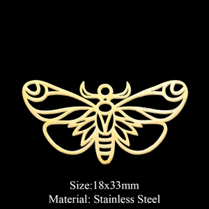 Detailed view of golden stainless steel moth pendant measuring 18x33mm on black background