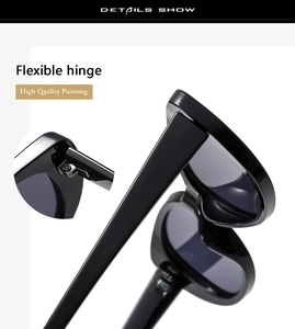 Detail showing high-quality flexible metal hinge and polished black resin sunglasses frame