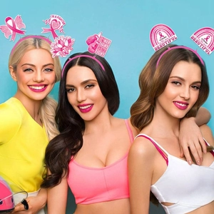 Pink Breast Cancer Awareness headbands with I'M A FIGHTER slogans worn by models