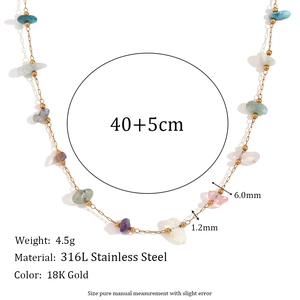 Detail of 18K gold plated 316L stainless steel necklace with natural colorful gravel stones