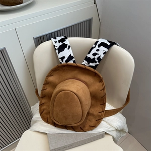 Creative western cowboy hat backpack in brown faux suede with cow print shoulder straps
