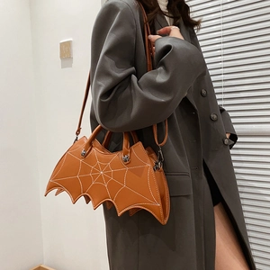 Brown gothic bat-shaped PU leather bag with spiderweb stitching and cross studs