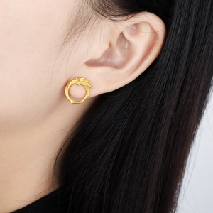 Irregular textured gold S925 silver stud earrings with sparkling zircon accents on ear