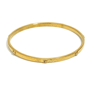 18K gold plated stainless steel bangle with hammered texture and sparkling white zircons