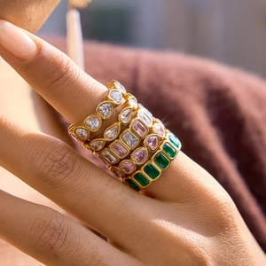 Stackable set of four gold-plated stainless steel rings with colorful zircon gemstones