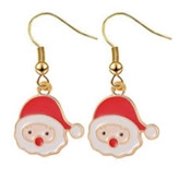 Close-up of festive Santa Claus enamel earrings in red and white alloy with gold hooks