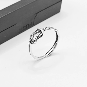 Retro S925 sterling silver twisted knot open ring with vintage finish on white background