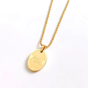 Minimalist gold stainless steel oval pendant necklace with Good Luck engraving on bead chain