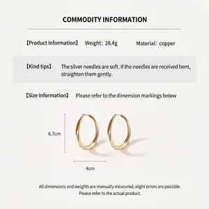 Macro detail of oversized gold twisted earrings with measurements and weight specifications