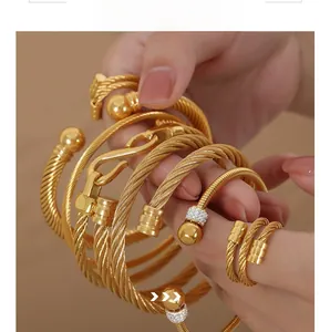 Detailed view of gold cable texture jewelry set with sparkling zircon stone accents