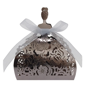 Detailed view of champagne gold girl silhouette candy box with laser cut floral patterns