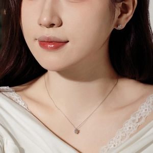 Elegant S925 sterling silver reindeer necklace and earrings set worn by a model