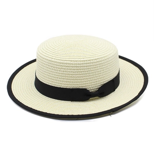 Straw boater hat for women with black ribbon bow and trim for sun protection beachwear