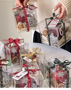 Detailed Christmas acrylic gift box featuring festive ornaments, ribbons, and bells