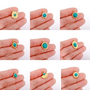 9-piece set of 18K gold plated stainless steel pendants with turquoise in sun designs