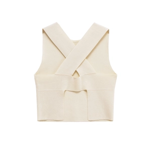 Minimalist cream knit crop tank top with criss-cross back straps on a plain background
