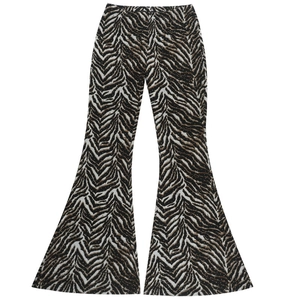 Detail shot of high-waisted zebra print flared trousers with bold black and brown patterns