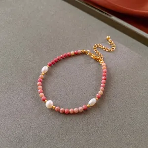 Handmade beaded freshwater pearl necklace with pink faceted stones and gold lobster clasp