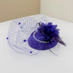 Vintage purple fascinator with floral accents, feathers, pearls and polka dot mesh veil