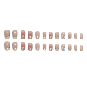 Pink gradient French press-on nails with hearts, glitter, and aurora rhinestones
