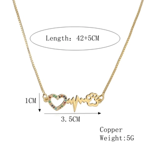 Detail showing 42+5CM gold heart necklace with colorful zircon and heartbeat design