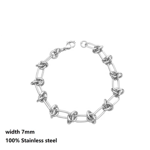 Detail of 7mm stainless steel oval link chain bracelet with lobster clasp and knot element