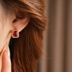 Elegant rectangle red gemstone earrings with micro-pawn diamonds in a gold setting
