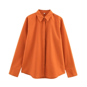 Close-up of bright orange linen shirt collar with S-size label on a white background
