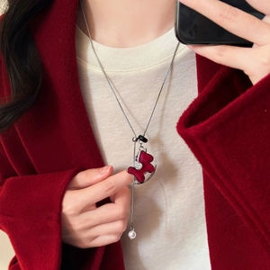 Detail of adjustable 70cm silver chain with red horse pendant and white pearl
