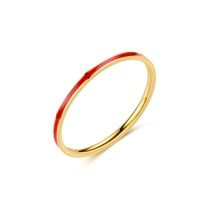 Detailed close-up of a slim golden titanium steel ring with thin red line decoration
