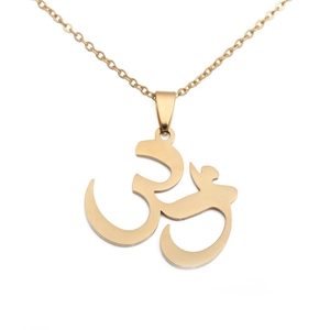 Macro view of gold stainless steel Om pendant necklace with polished religious 3D symbol