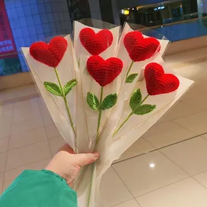 Handmade crochet heart bouquet with red knitted hearts and green leaves for Mother's Day gifts