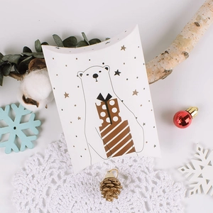 Minimalist white pillow gift box with polar bear illustration and golden stars