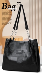 Detail of black PU leather tote bag showing patchwork texture and metal chain strap
