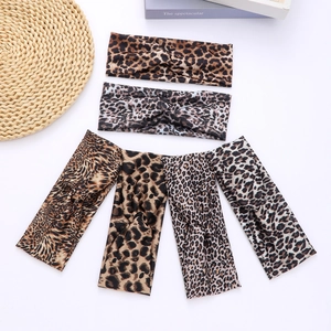 Set of 6 leopard print elastic twist headbands in various colors on a clean white background