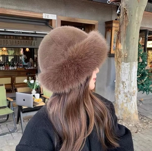 Luxe dark brown faux fur bucket hat for winter warmth with a fluffy and plush texture