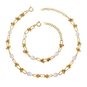 Golden titanium steel jewelry set with freshwater pearls including necklace and bracelet
